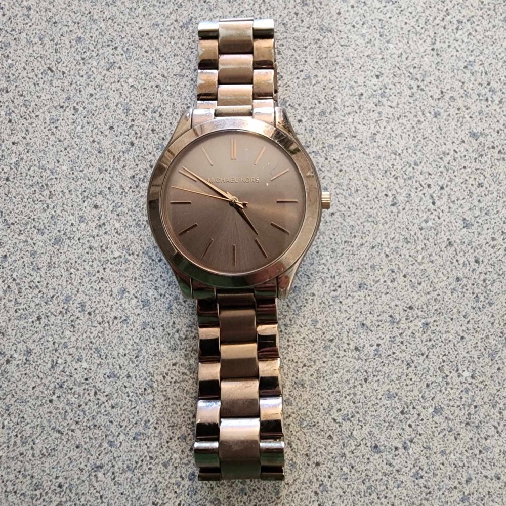 Rose gold Michael Kors watch. Used and in good condition. Requires new battery.